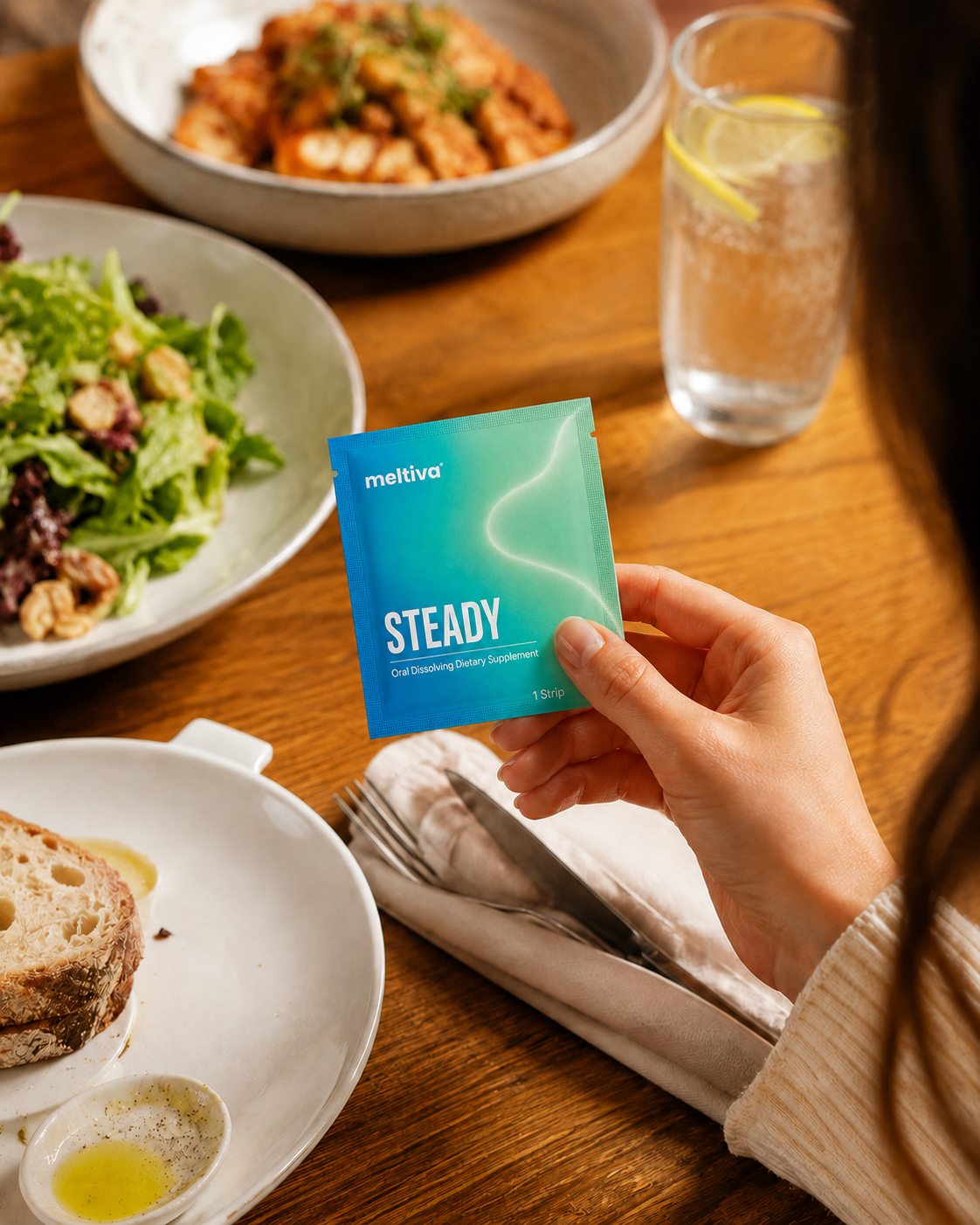 Discreetly using a Meltiva strip at a dinner table