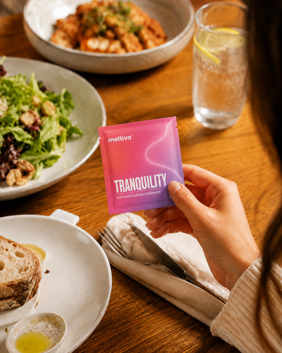 Discreetly using a Meltiva strip at a dinner table